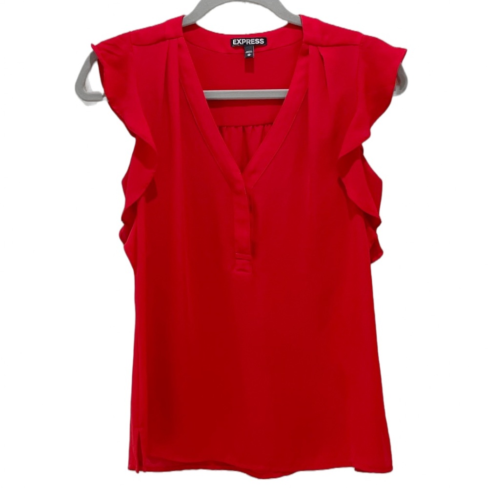 Red blouse with ruffle sleeves.